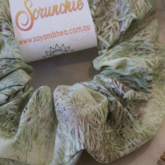 The close up of the Meadows Scrunchie shows a watercolour image of thick grass