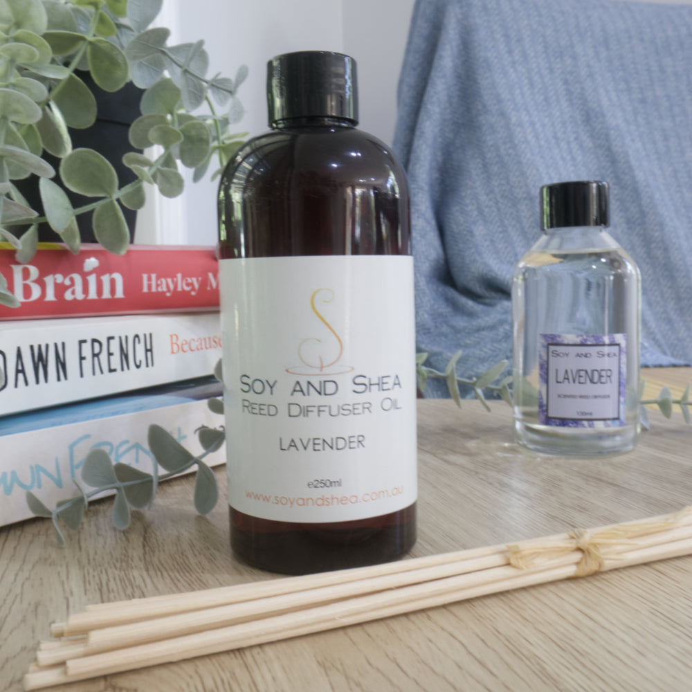 Soy and Shea Reed Diffuser Oil in plasitic bottle with lavender scent on a wooden surface.