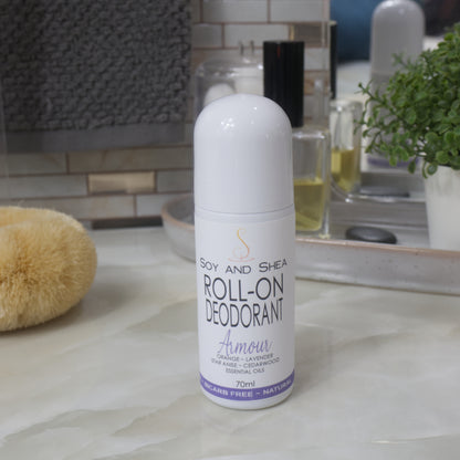 A white bottle with deocrative product label stands on a bathroom counter top.  The bottle is tall with a dome shaped cap.