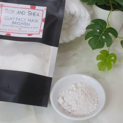 Soy and Shea Clay Face Mask packaging with a bowl of powder on a light background
