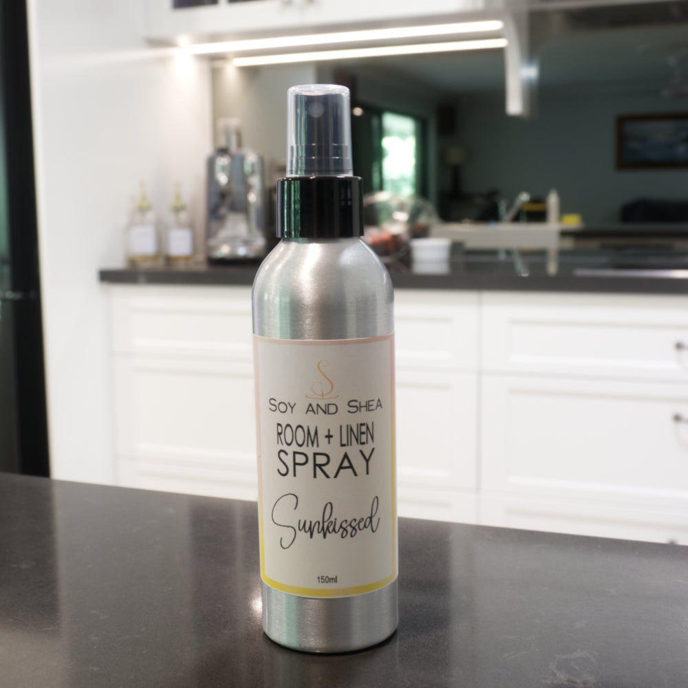 Room and linen spray bottle on a kitchen counter with a blurred background